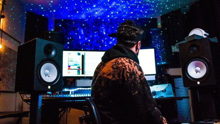 musician in studio with galaxy lighting