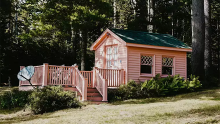 pink she shed under trees