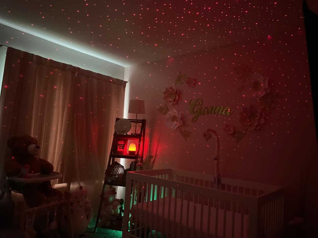 nursery with crib and red starry lights