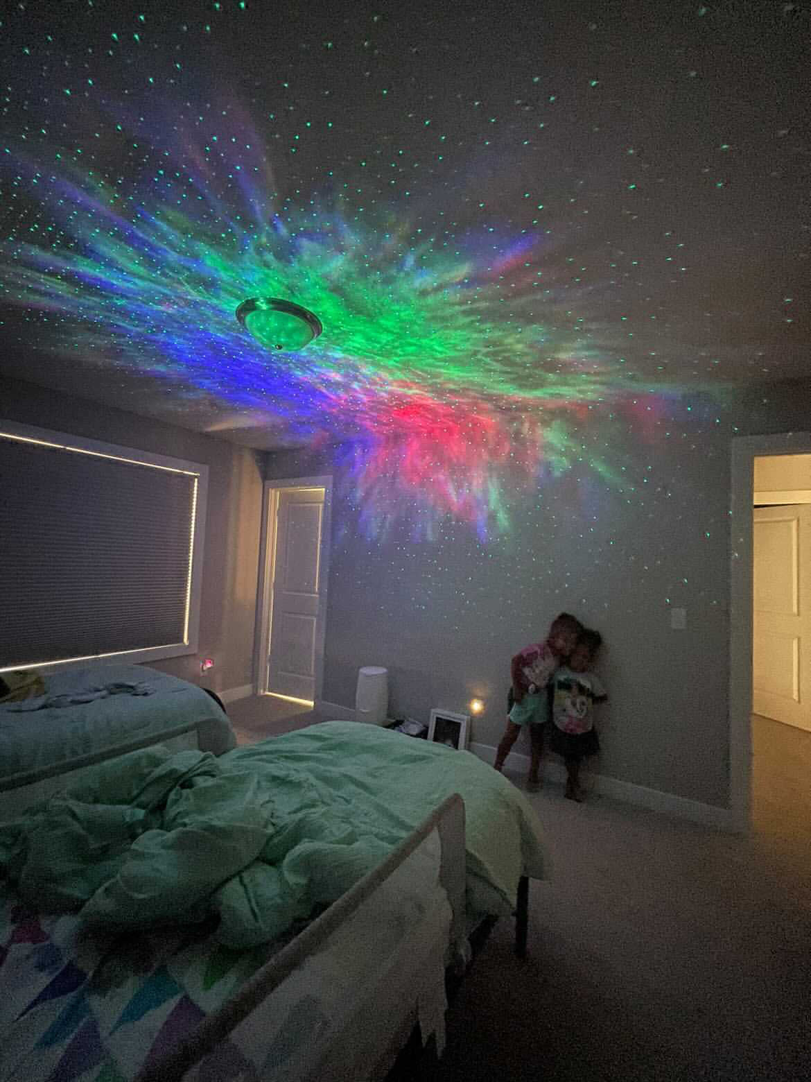 bedroom with sky lite 2.0 shining on ceiling