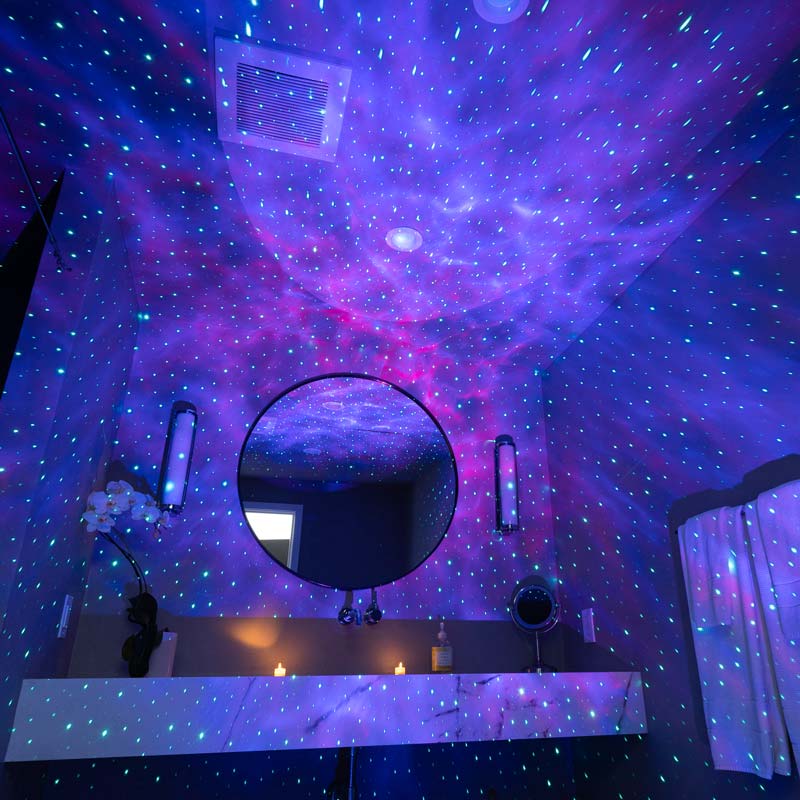 sky lite evolve smart galaxy projector in bathroom, pink and purple galaxy light