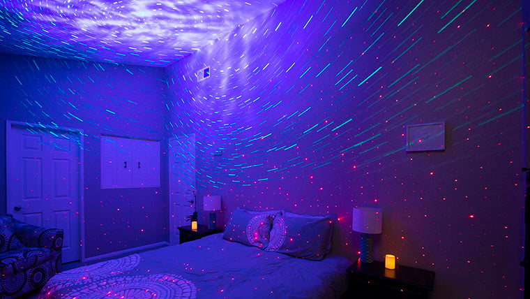 long exposure shot of bedroom with galaxy lights and star projectors
