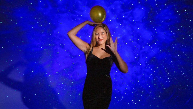 woman posing with balloon