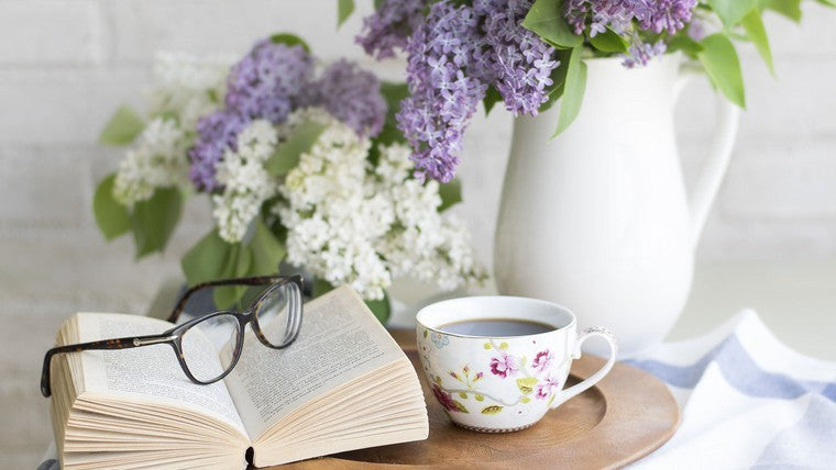 cozy nook with glasses book and flowers