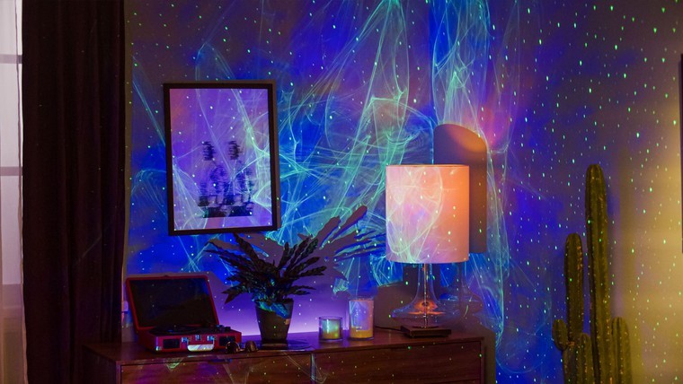 desk with ark aurora light and skylite galaxy projector