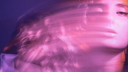 woman in pink and purple lighting