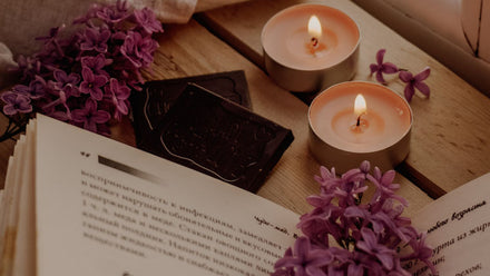 desk with lavender books and calming candles