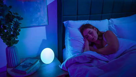 woman sleeping next to mood light