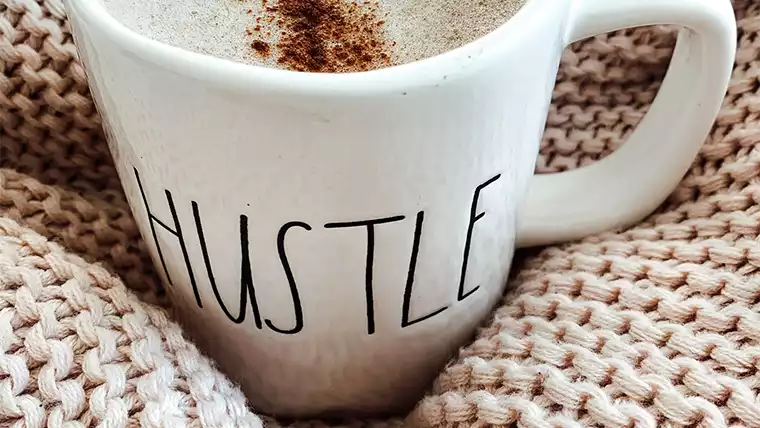 coffee mug that says hustle