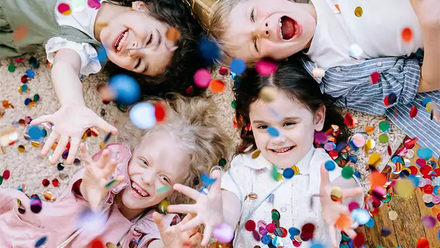 smiling laughing children with confetti