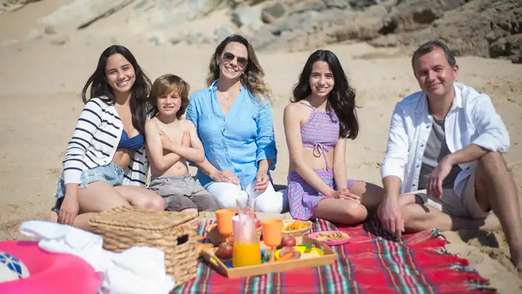 family having beach picnic