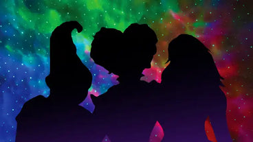 silhouettes of three witches with red blue and green galaxy lights
