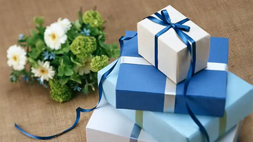 blue gift boxes with bouquet of flowers