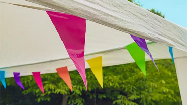 party tent with colored pennant flags