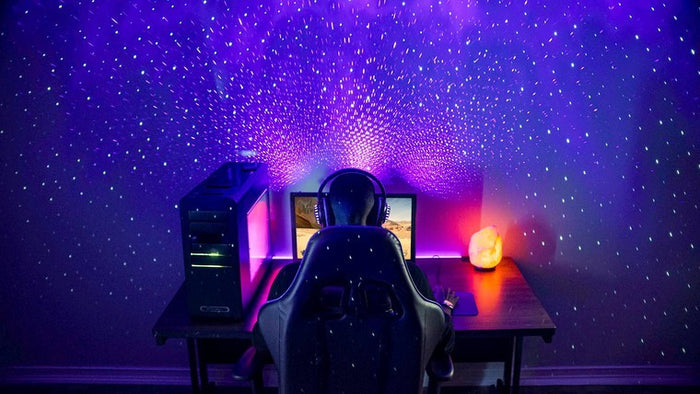 pc gamer with star projector lights