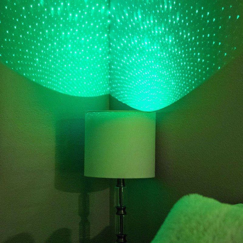 lamp with blissbulb in green, star light bulb, shines thousands of colorful laser stars