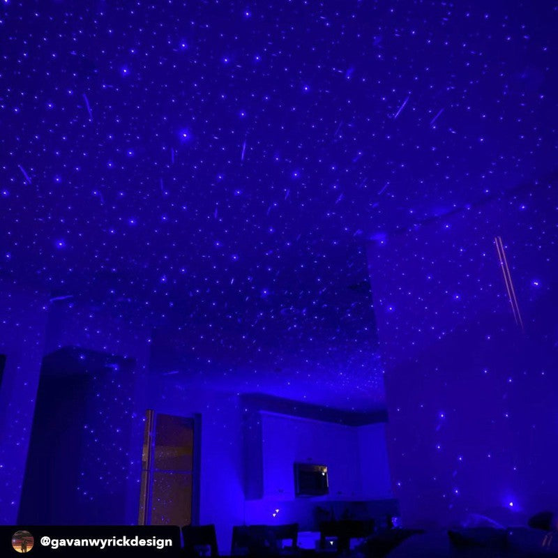 blue starport laser usb star projector shining on ceiling by gavanwyrickdesigns